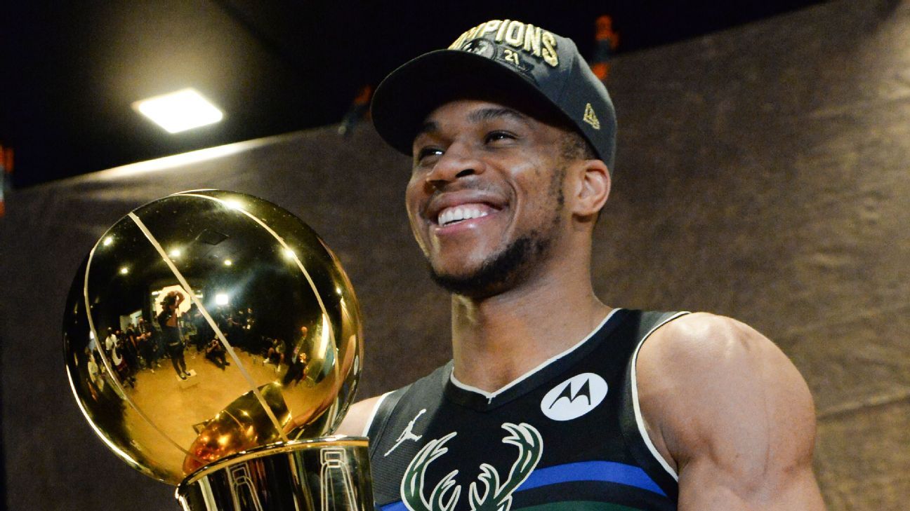 Giannis Antetokounmpo Milwaukee Bucks Unsigned 2021 NBA Finals Larry O'Brien Trophy and Bill Russell MVP Photograph