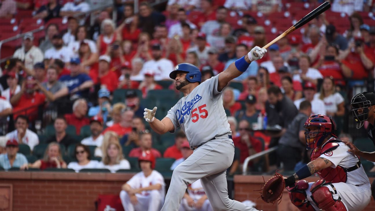 Albert Pujols, of the Los Angeles Dodgers, throws the first home run in what his teammate calls a “surreal” scene in St. Louis.  Louis
