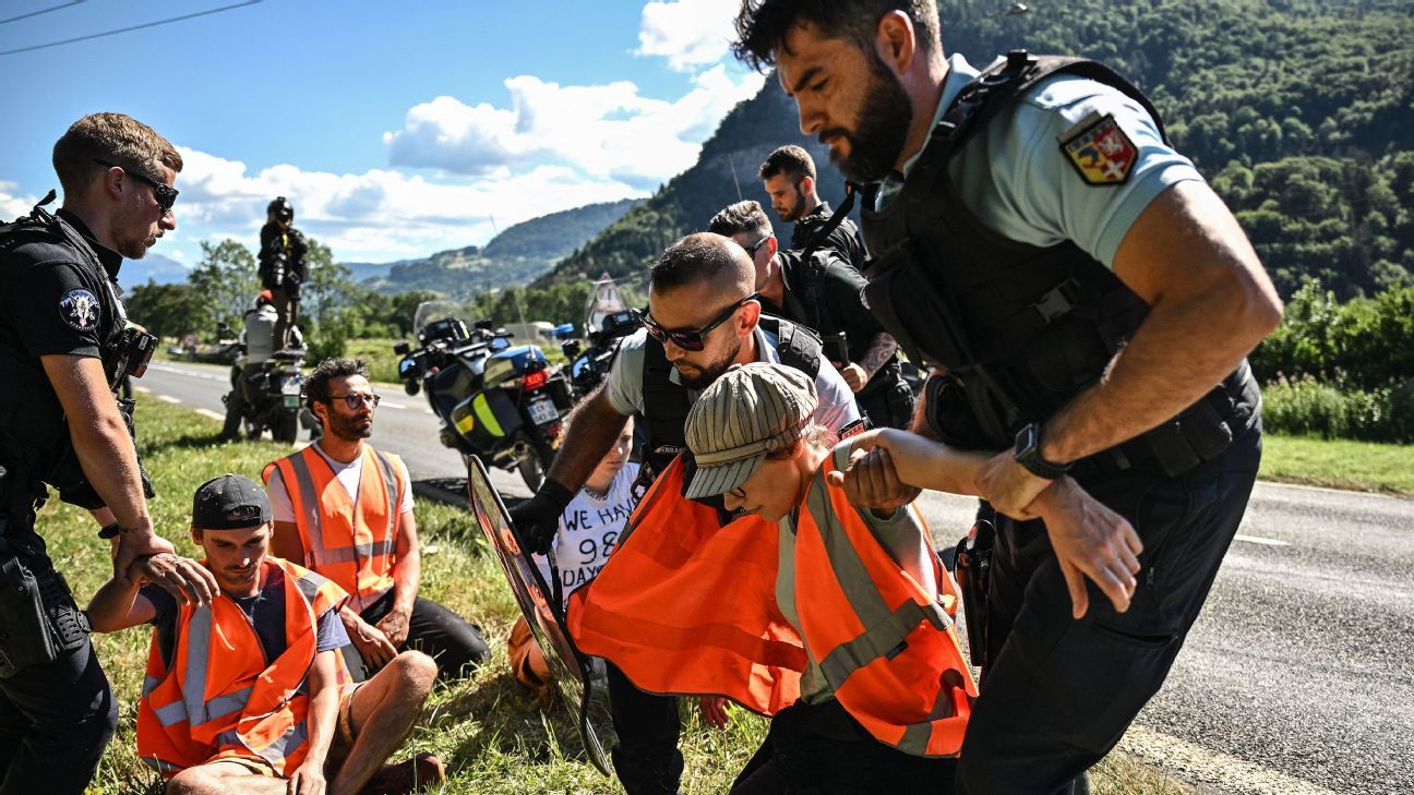 Tour de stage 10 halted as climate protesters dragged away by police, officials