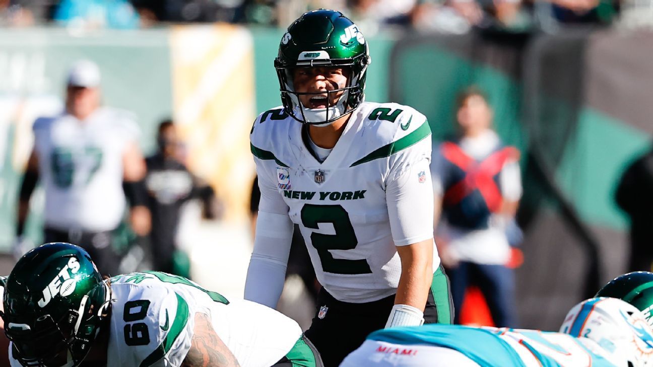 Zach Wilson steps into the huddle again for the Jets with Aaron