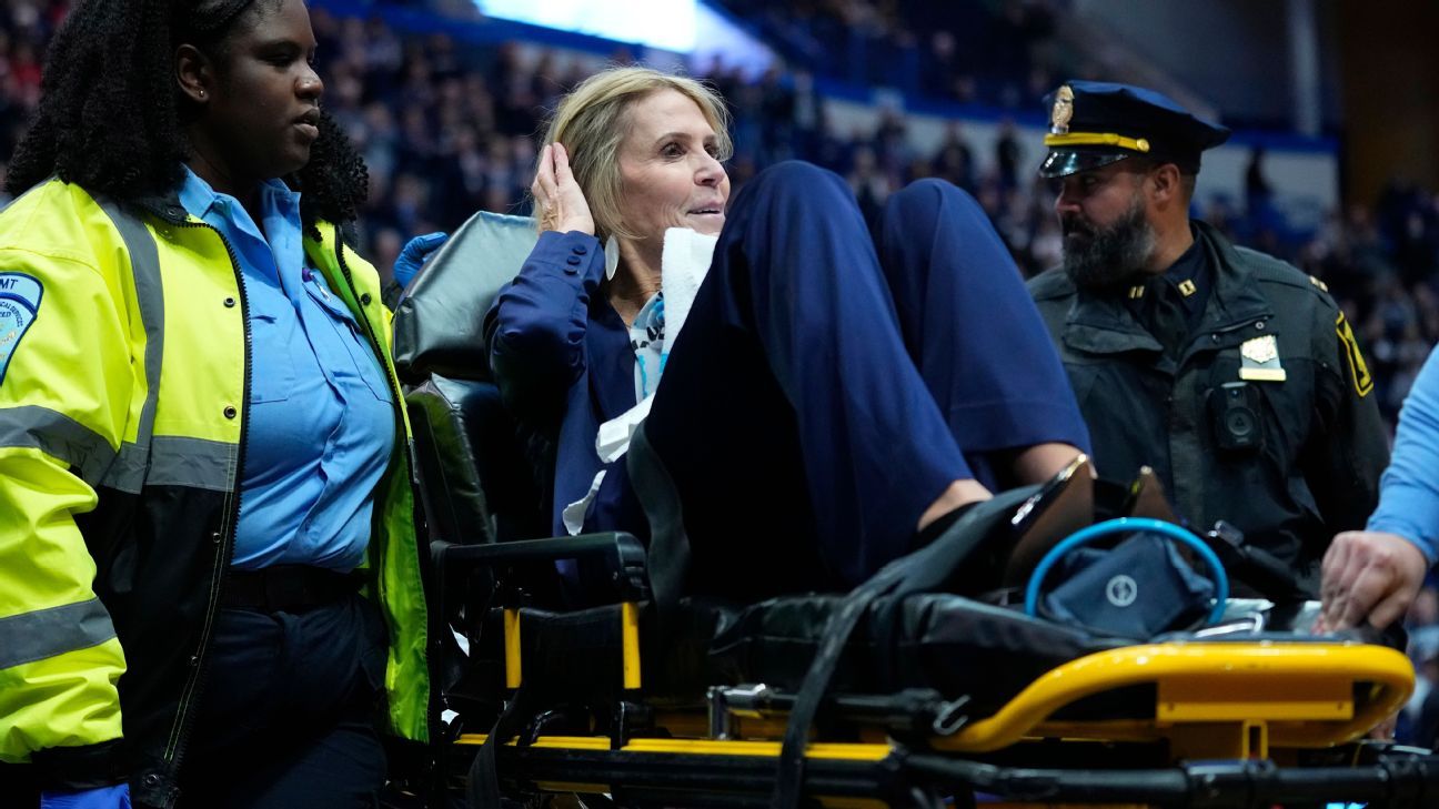 UConn assistant Chris Dailey appears to faint before game