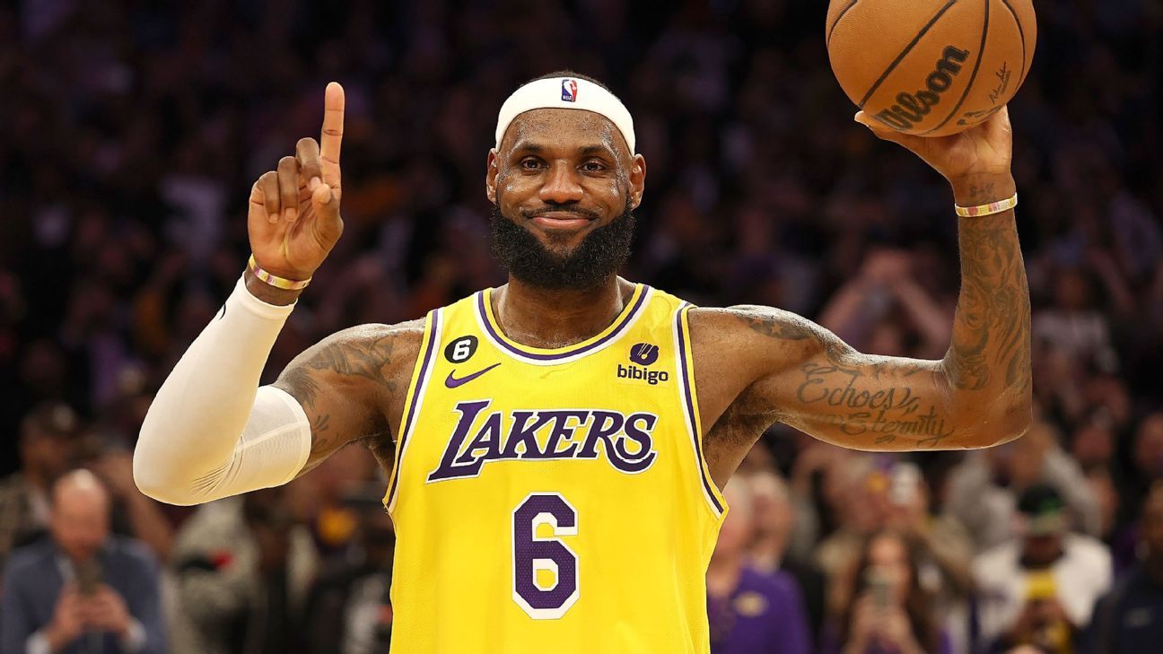 photo of lebron wearing lakers uniform flexing on the court lebron james  background the king written