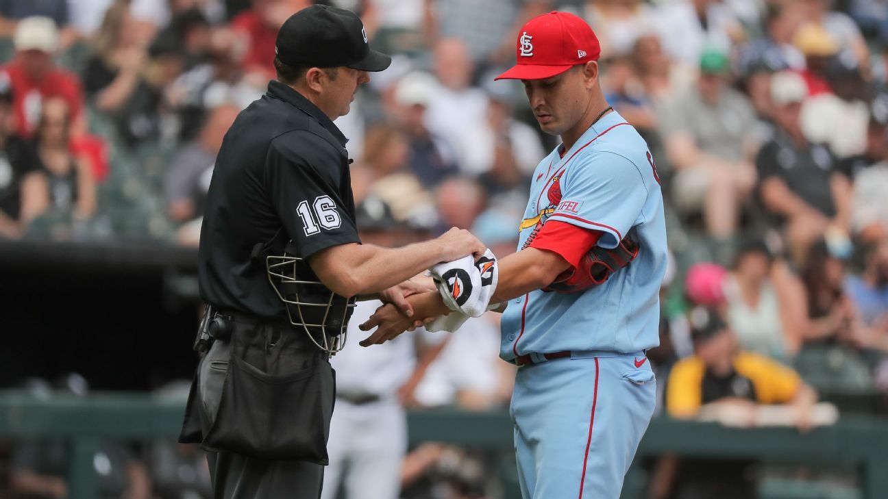 Ump wipes down Cards' Gallegos after rosin use