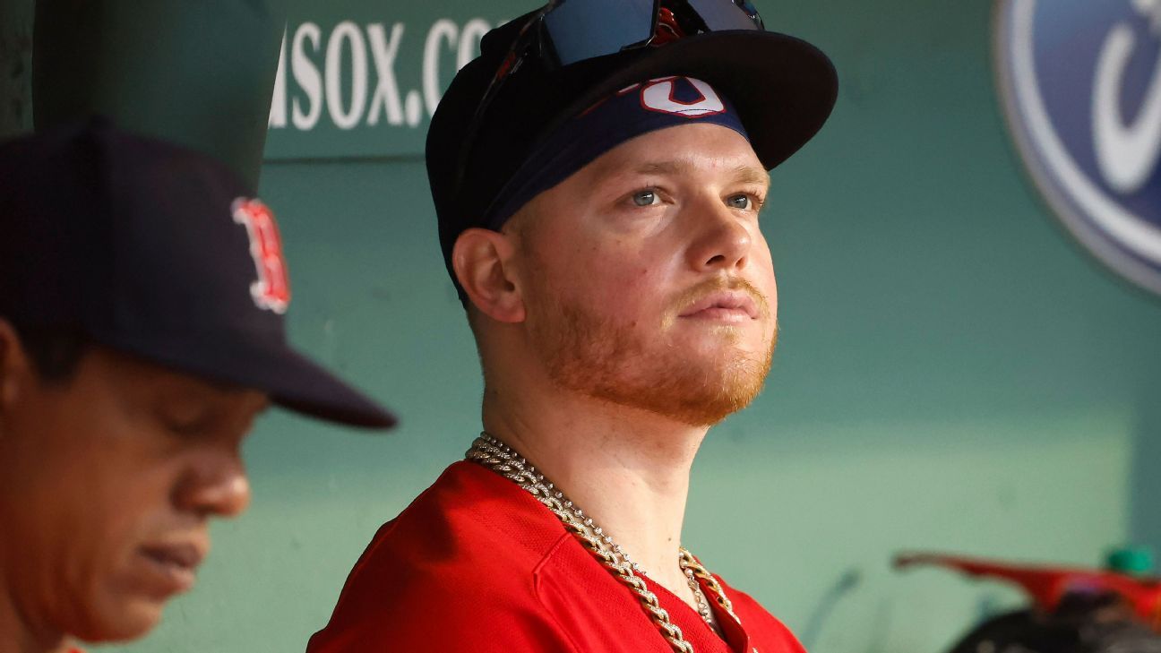 The chain of Alex Verdugo of the Boston Red Sox hangs from his