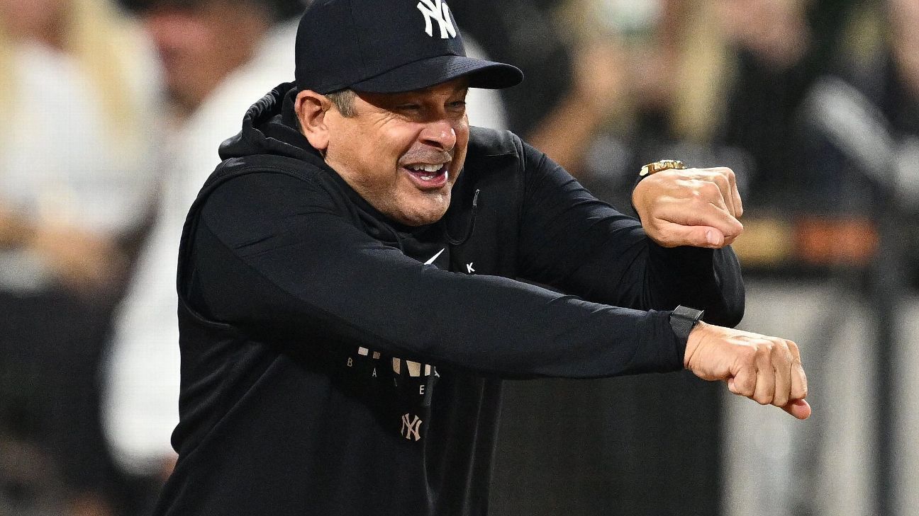 New York Yankees manager Aaron Boone imitates an umpire calling strike  three after arguing with home plate umpire Laz Diaz during the eighth  inning of a baseball game against the Chicago White