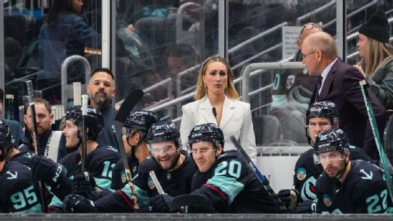 Jessica Campbell coaching behind NHL bench