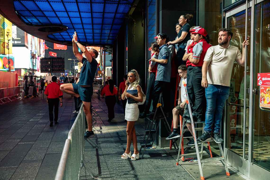 People watching boxing from above Times Square
