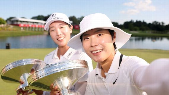 Jin Hee Im and Somi Lee of south Korea pose with their trophies after winning the Dow Championship at Midland Country Club.