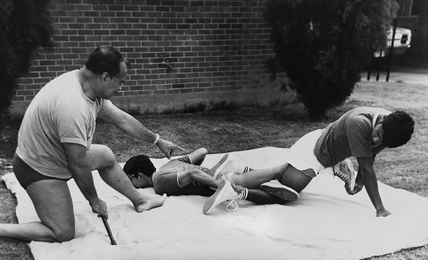 Eddie Guerrero: Legado Inmortal en la Lucha Libre y el Corazón Latino 4 In the family's backyard, Gory Guerrero and his sons honed their skills and techniques. For them, it wasn't just a job; it was a calling. Something that each member took seriously. Pictured here -- Gory with Chavo Sr. and Mando Guerrero.